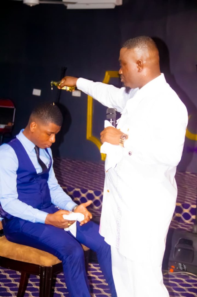 Prayer and anointing during a leadership service at Emet House Chapel